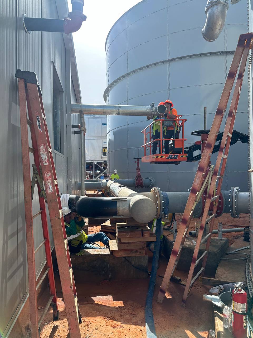 Large-diameter pipe installation on commercial job site